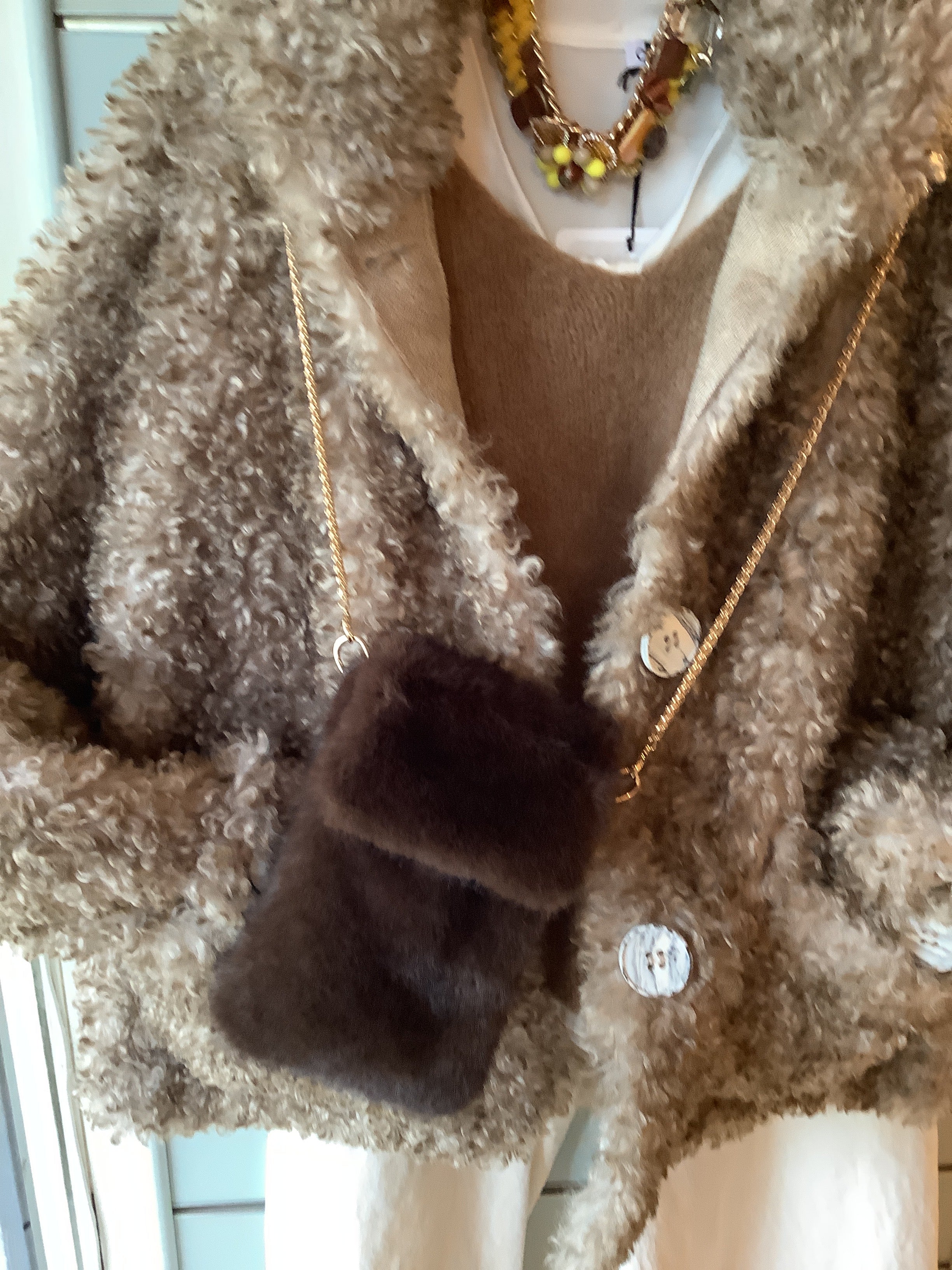 Faux fur phone bag.