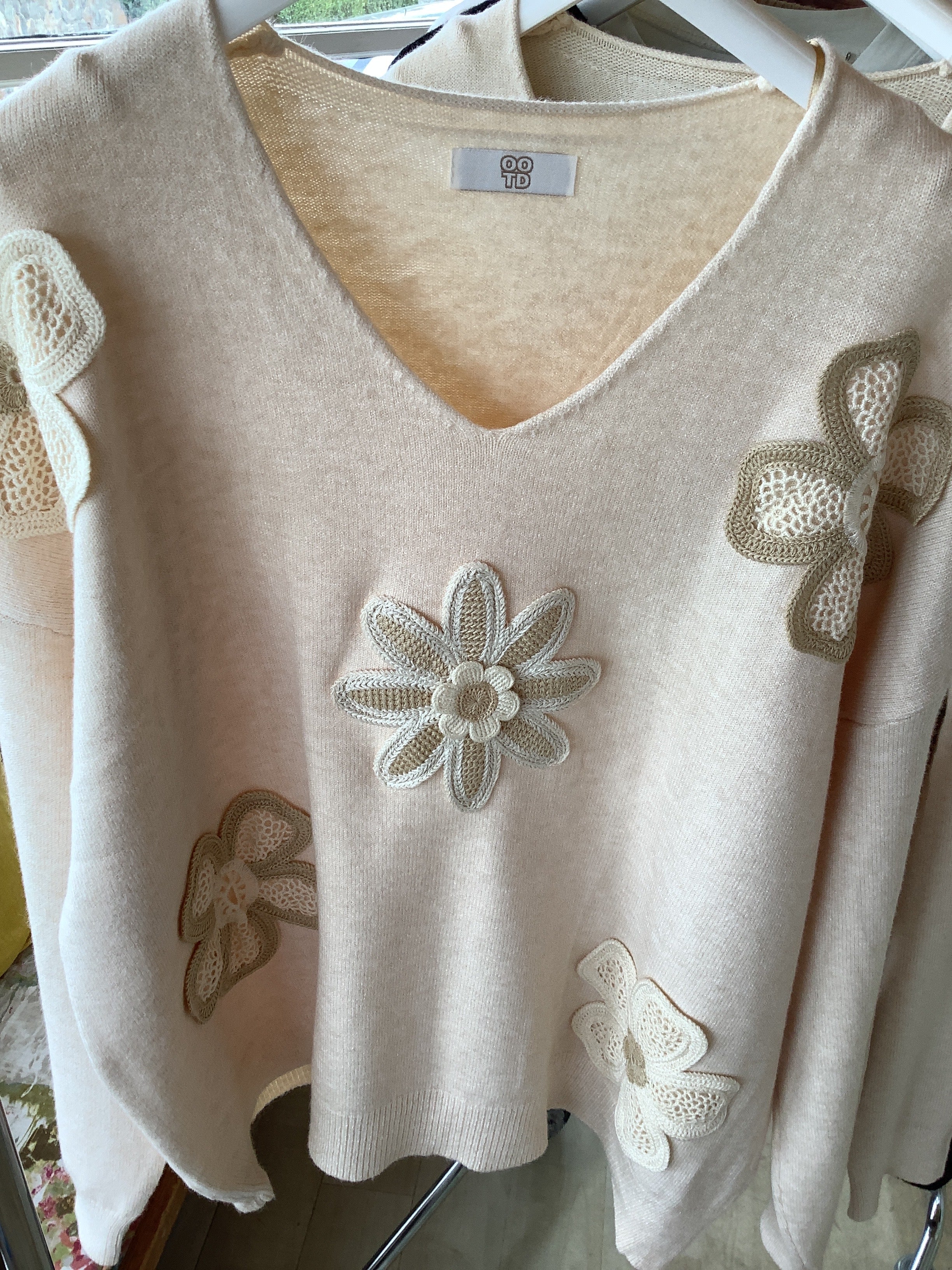 Crochet floral sweater.