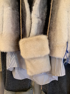 Faux fur phone bag.