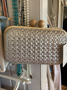 Woven raffia clutch bag.