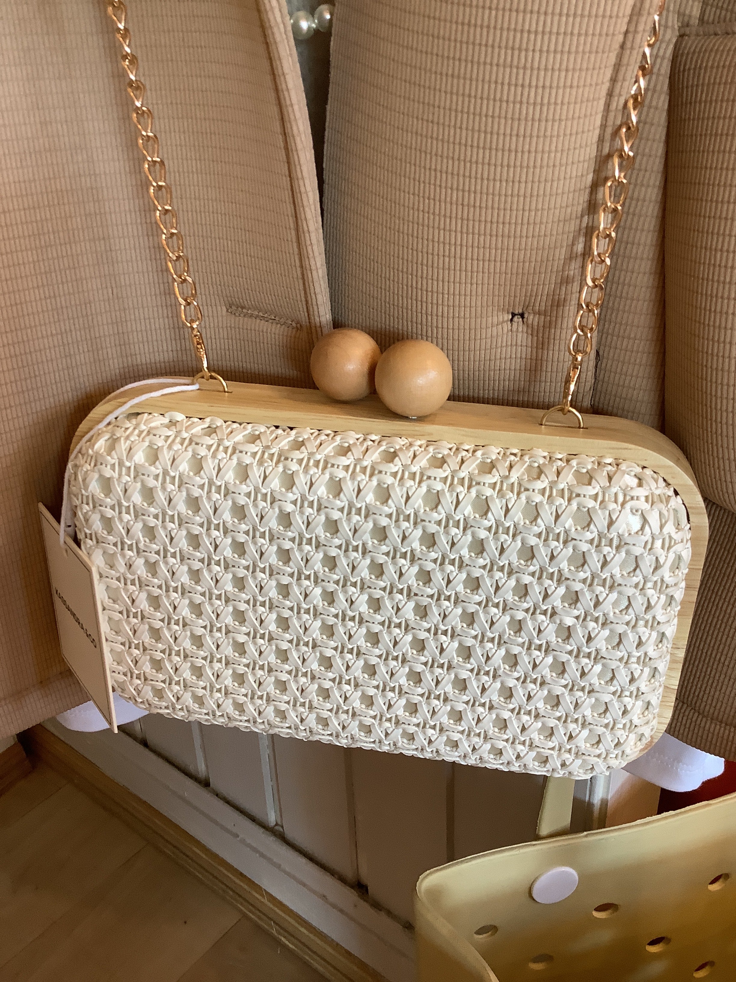Woven raffia clutch bag.