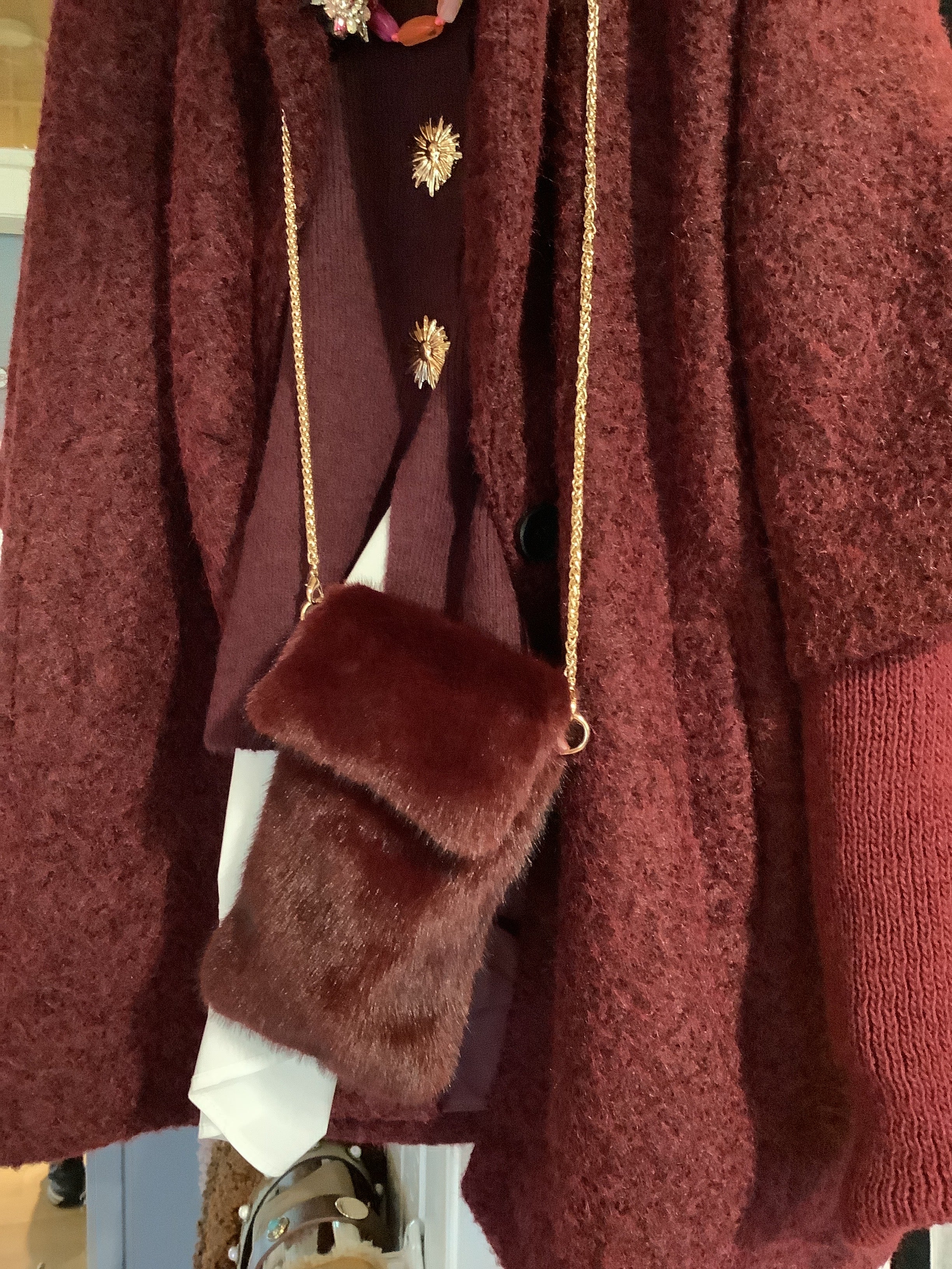 Faux fur phone bag.
