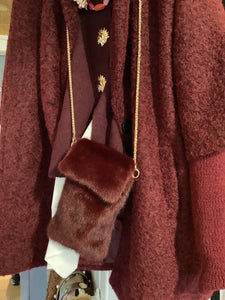Faux fur phone bag.