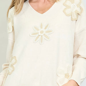 Crochet floral sweater.