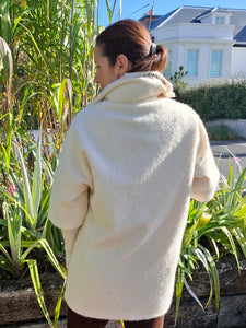 Cosy coat with ribbed sleeve