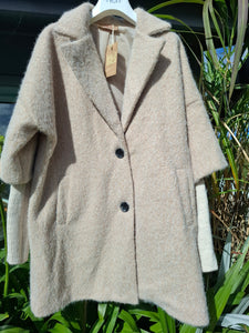 Cosy coat with ribbed sleeve