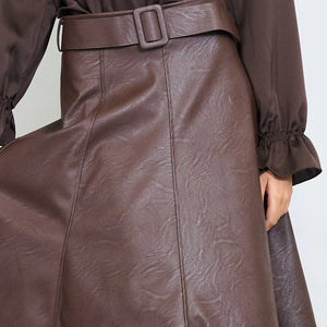 High-waist belted faux leather midi skirt