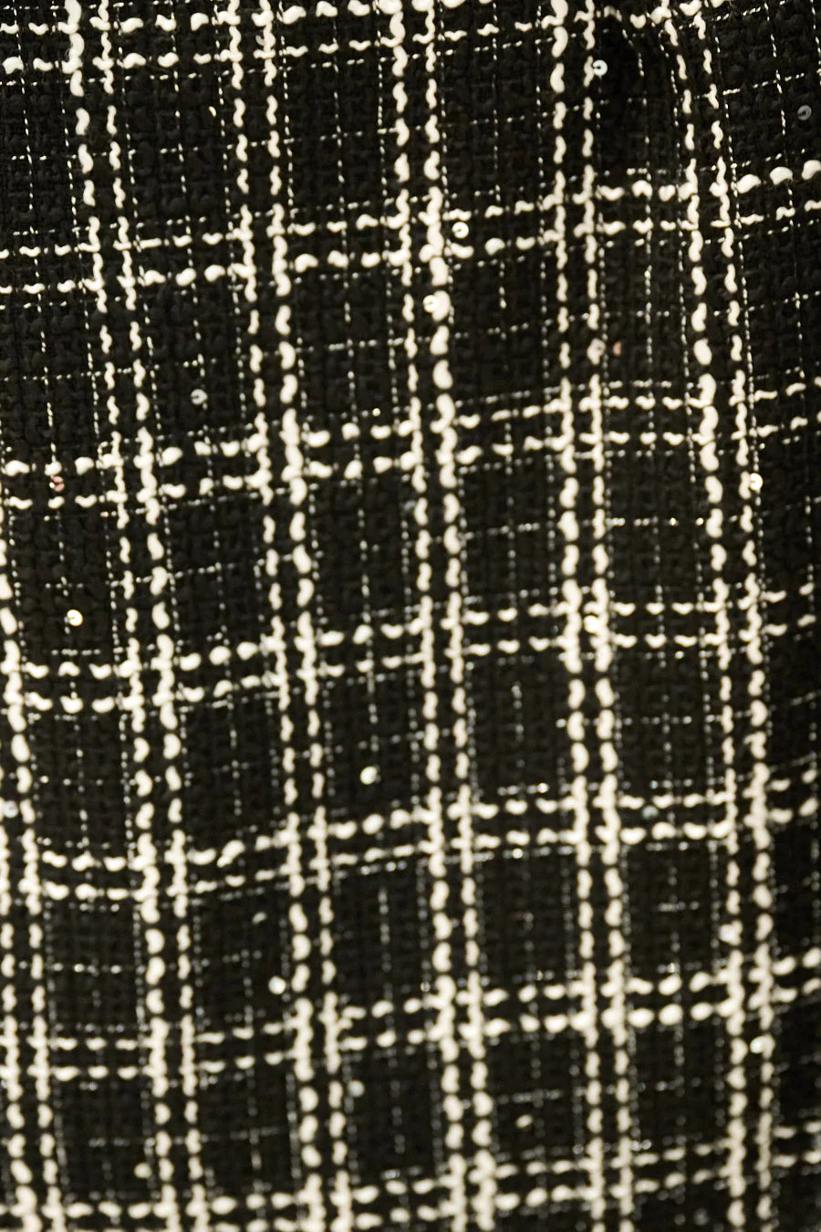 Luxury tweed sleeveless vest.