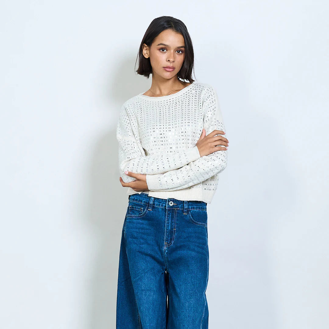 Knit sweater with openwork design