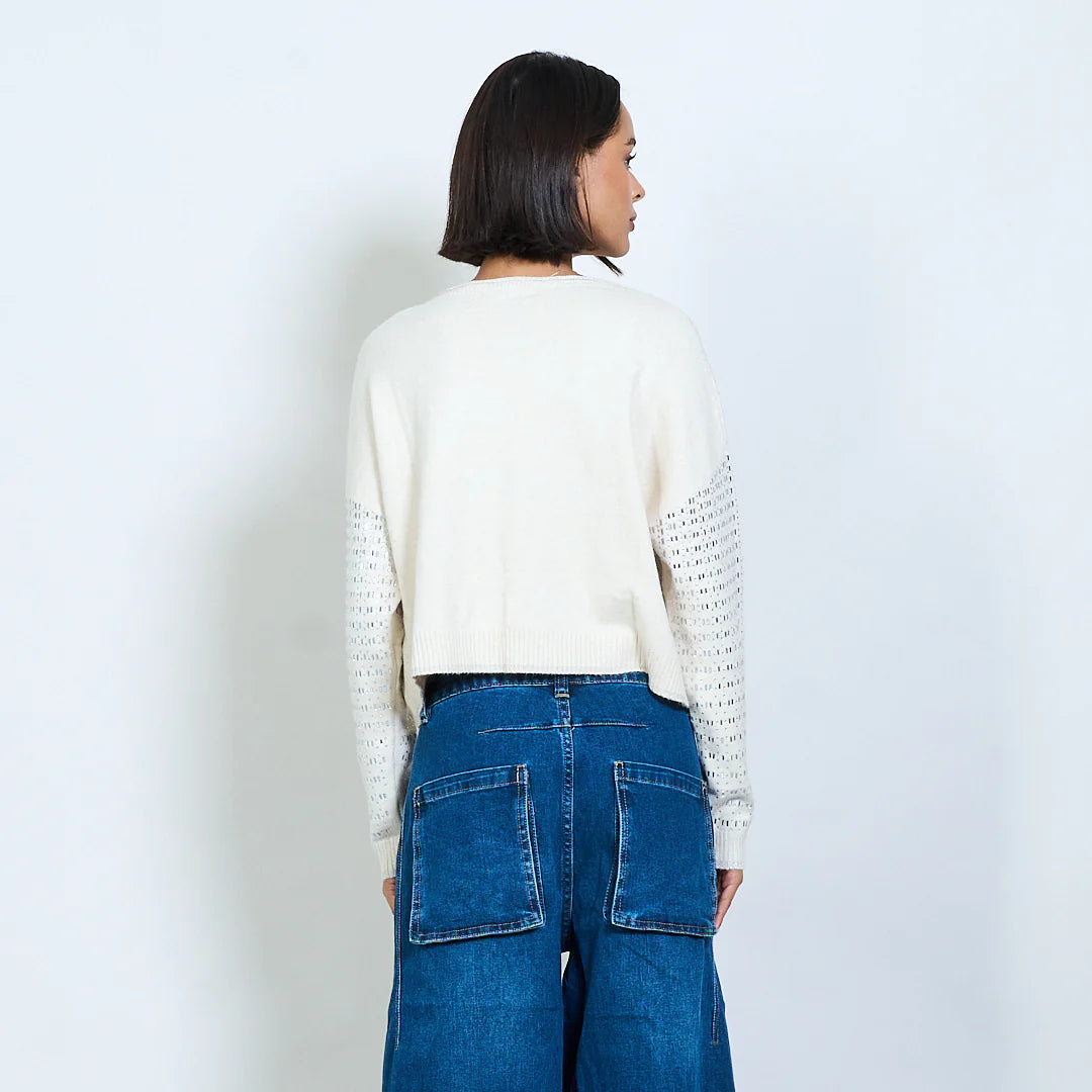 Knit sweater with openwork design