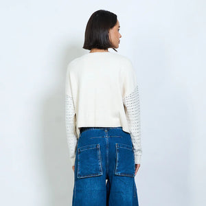 Knit sweater with openwork design